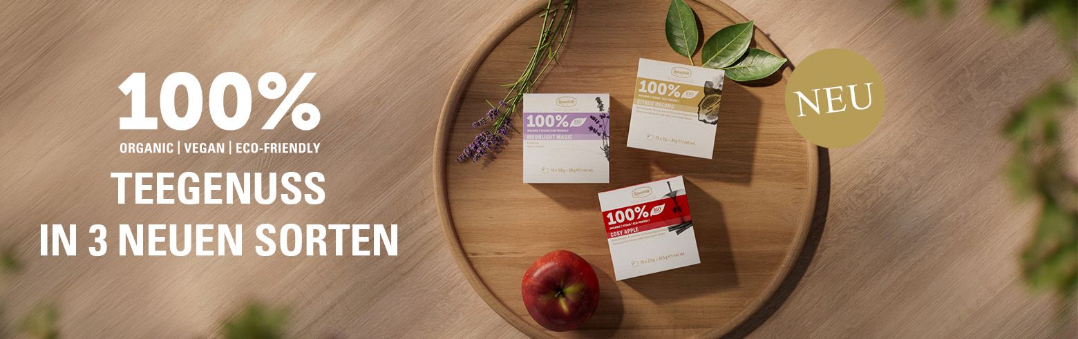 Banner mit drei neuen Teesorten auf Holztablett und Text „100 % Teegenuss in 3 neuen Sorten“, mit „Neu“-Hinweis